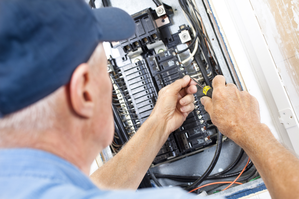 Electrician fixing the panel