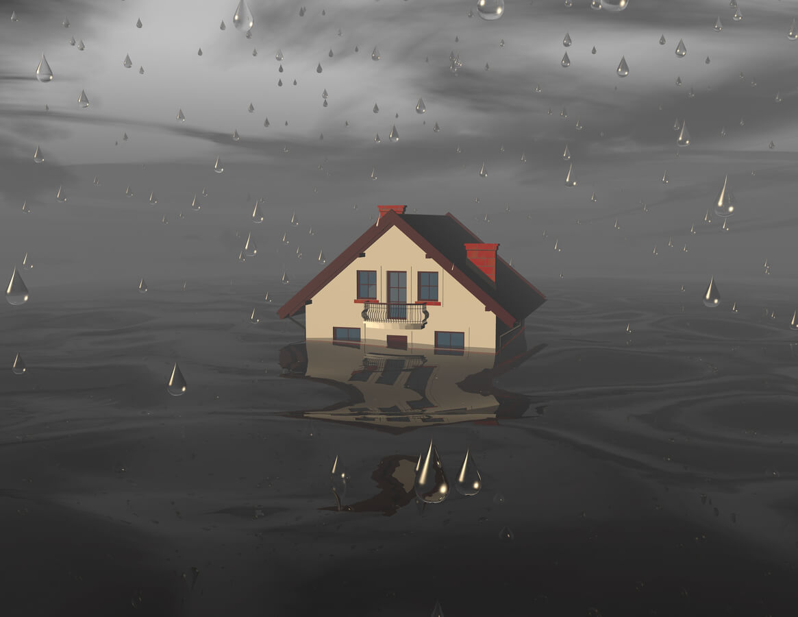 A small house sits in a dark flood with rain falling all around.