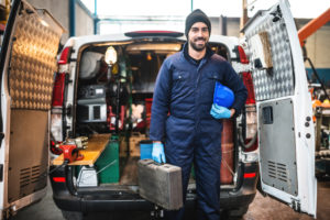 plumber outside of work van