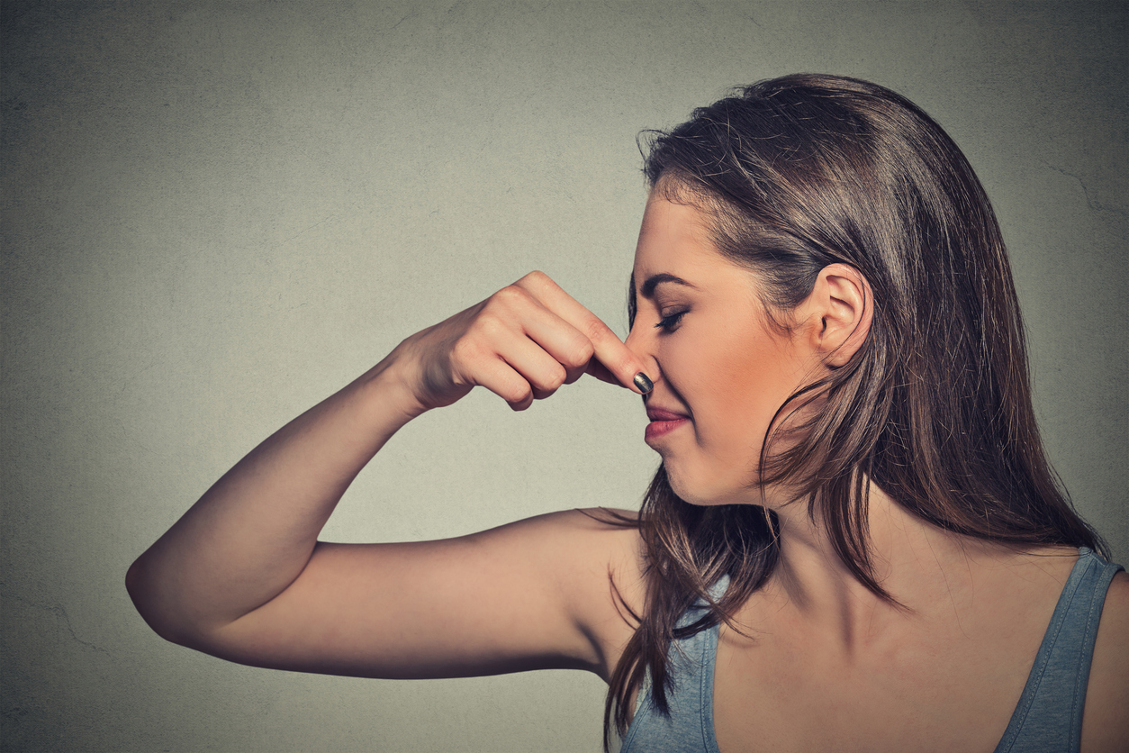 Woman pinching her nose